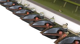 For clean cutting, even under adverse conditions (e.g. moist plants, weeds), the short knife guards are open at the front. - Front attachments